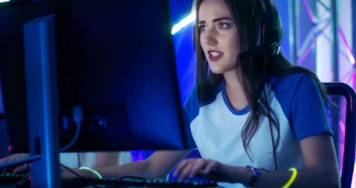 Female gamer playing at a competition.