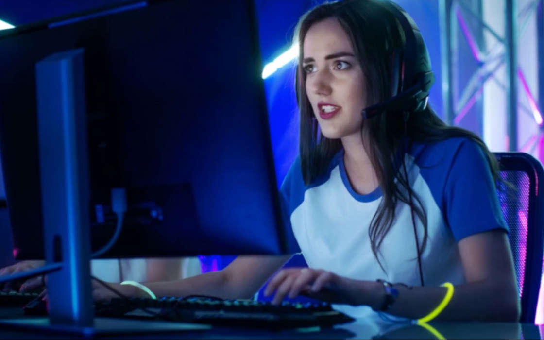 Female gamer playing at a competition.