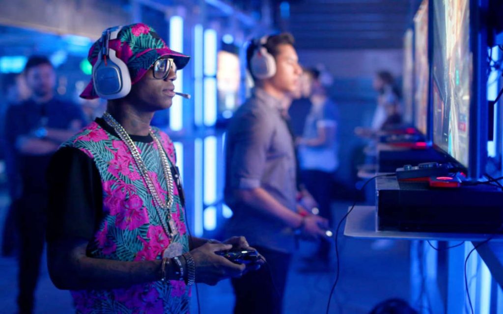 Soulja Boy enjoying his consoles.