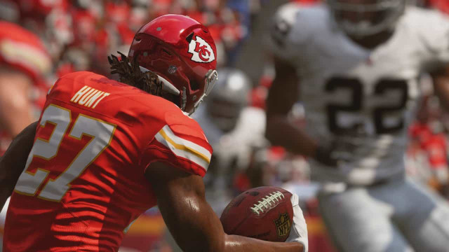 An EA Madden NFL player running with the ball.