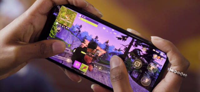 Someone playing Fortnite on their mobile phone.